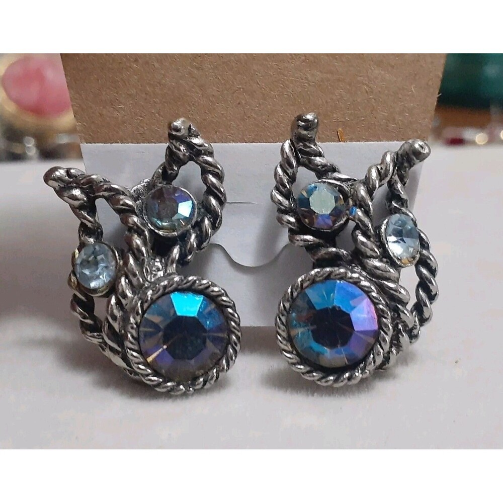 Blue fauceted Aurora borealis Silvertone braided metal abstract clip on earrings